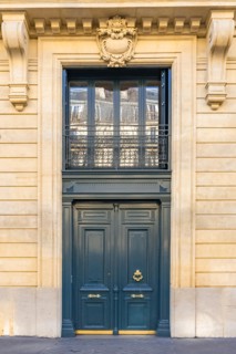 Paris, beautiful wooden door, typical window in the Marais