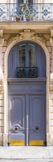 Paris, beautiful wooden door, typical window in the Marais