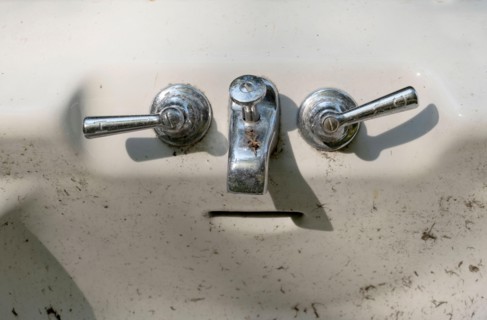 porcelain bathtub appears to have a face, with the handles being eyes, the faucet a nose and the over flow slit a mouth. a concept called pareidolia