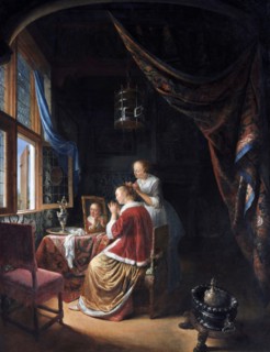 A Young Woman at her Toilet by Gerrit Dou (1613-1675), oil on panel, 1667