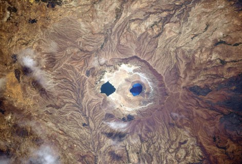 A view of Earth from the International Space Station: Isolated and colourful caldera lakes somewhere between Sudan and Chad, Africa Ê An optimised and digitally enhanced version of a NASA/ ESA image. ...