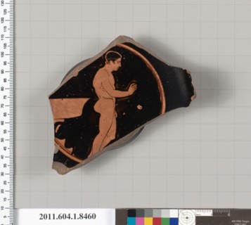 Terracotta fragment of a stemless kylix (drinking cup) 460–450 B.C. Greek, Attic Interior, filleted youth to right, holding a fillet in his right hand; behind him, a laver, on two steps; Exterior, sta...