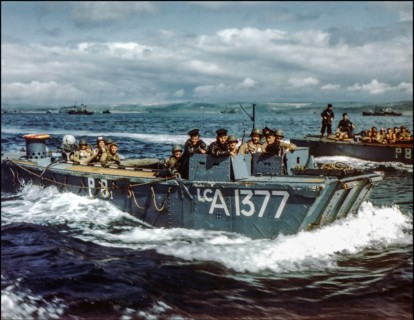 D-Day rehearsals WW2 1944  British Navy Landing Craft LCA-1377 in preparations for D-Day, carries American troops to a ship, in a British port during preparations for the Normandy invasion, circa May-...