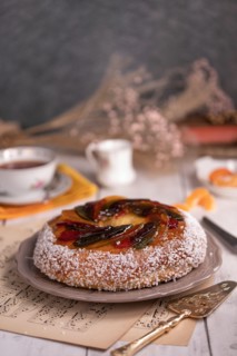 Rosca de reyes, king cake, glazed fruit, Provencal Galette des rois for the Epiphany on a wooden table