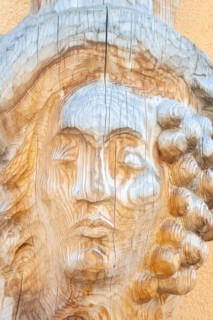 Man portrait carved on wood