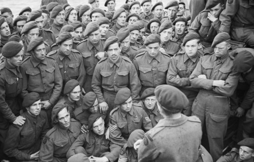 Operation Overlord (the Normandy Landings)- D-day 6 June 1944 Men of 4 Commando being briefed by Lt Col R Dawson in preparation for D Day.