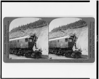 United States President Warren G Harding in the cab of Great St Paul electric locomotive Falcon Idaho Stereograph