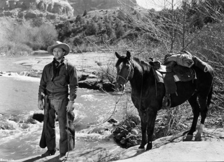 1948, Film Title: BLOOD ON THE MOON, Director: ROBERT WISE, Studio: RKO, Pictured: CLOTHING, HORSE, ROBERT MITCHUM, WESTERN, COWBOY, NATURE, RIVER, CHAPS, COWBOY HAT, NECK SCARF, DRIFTER, NOMAD. (Cred...