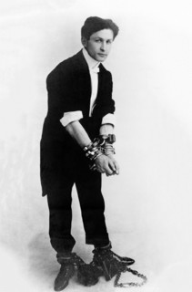 Escapologist Harry Houdini (born Erik Weisz) in chains, c. 1905