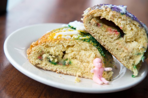 Plated slices of New Orleans king cake.