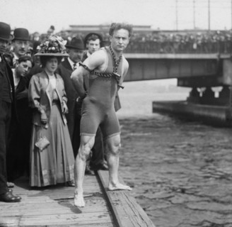 Houdini jumps from Harvard Bridge, 1908, Houdini standing by the side of the Charles River wearing chains and handcuffs.
Harry Houdini (1874 – 1926) Austro-Hungarian-born American Escape Artist, illus...
