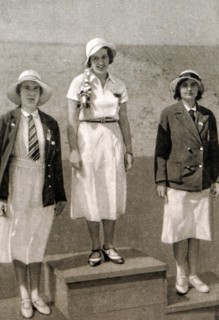 Photograph of the podium for the women's foil at the 1932 Olympic games. Ellen Müller-Preis (1912 - 2007) took gold for Austria, Heather Seymour "Judy" Guinness (1910 - 1952) silver for Great Britain ...