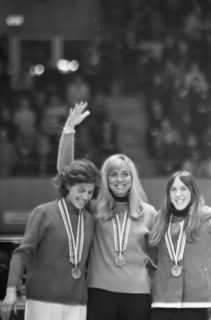 Winter Olympics in Grenoble  The honorary stage for the medalists in skating for women over 1000 meters. From left to right Lyudmila Titova (USSR, second), Carry Geijssen (Netherlands, first) and Dian...