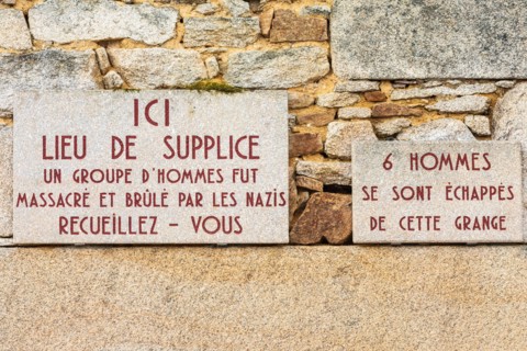 Europe, France, Haute-Vienne, Oradour-sur-Glane. Sept. 5, 2019. Signs saying 'Place of Torture, a group of men was massacred and burnt by the Nazis' a