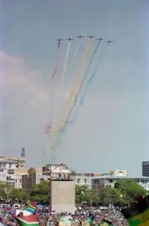 A display with coloured smoke by the Silver Falcons, aerobatic team of the South African Air Force, at Nelson Mandela's inauguration in Pretoria, 1994.