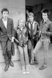 Sex Pistols punk rock band seen here in a London  Circa 1st May 1977
Left is Johnny Rotten - singer 
2nd left is Paul Cook - drums
3rd from left is Steve Jones - electric guitar 
Far right is Sid Vici...