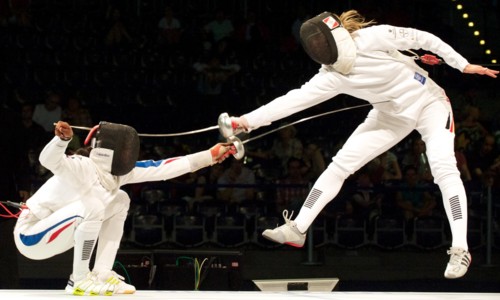 The German epee fencer Britta Heidemann (R) fights against against Laura Flessel-Colovic from France during the European Fencing Championship in Leipzig, Germany, 21 July 2010. France won the team com...