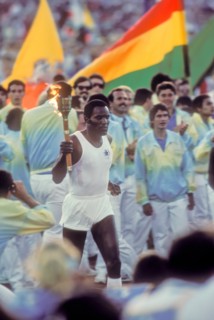 Rafer Johnson brings Olympic torch during opening ceremonies at 1984 Olympic Games in Los Angeles.
