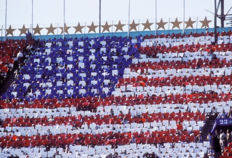 Card display in stadium during opening ceremonies at 1984 Olympic Games in Los Angeles.
