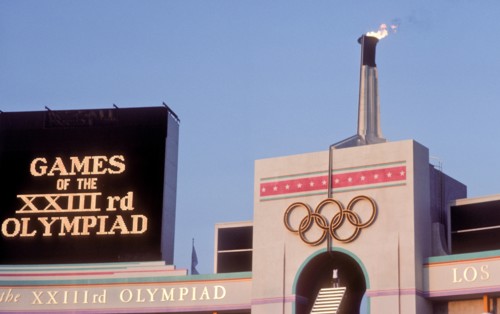 Rafer Johnson brings Olympic torch to light flame during opening ceremonies at 1984 Olympic Games in Los Angeles.