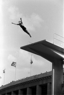 Summer Olympics 1936 - Germany, Third Reich - Olympic Games, Summer Olympics 1936 in Berlin. Men swimming competition at the swimming stadium  - platform  diver - view of the jump. Image date August 1...