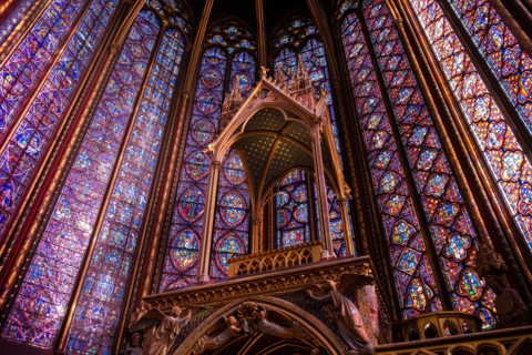 The Sainte-Chapelle church walls filled with colorful stained glass window panels in Paris, France, Europe
