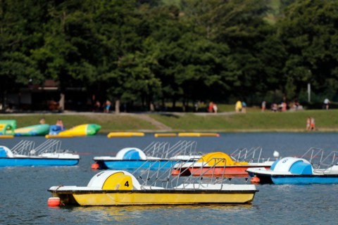 Passy lake in summer. Pedalo for rent.   France.