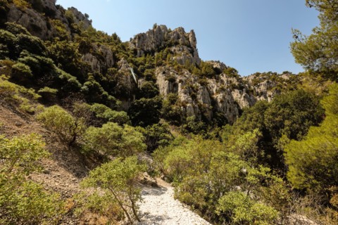 Hiking,path,to,Calanque D'En Vau,beach,from,top of cliffs above,difficult,hike,with, sandy,beach,tour boats,and,cliffs.Marseille,Calanques of Marseille,Calanques National Park,Marseilles,Commune in, B...