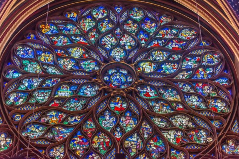 Paris, France - Dec. 27 2022: The stunning stained glass window and the beautiful ceiling in Saint-Chapelle in Paris