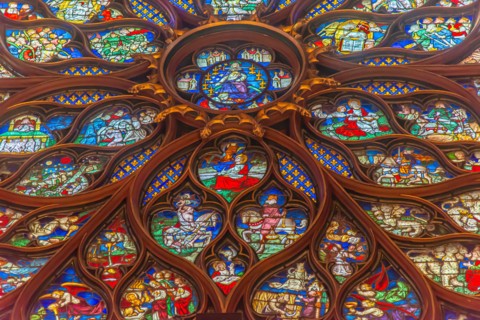 Paris, France - Dec. 27 2022: The stunning stained glass window and the beautiful ceiling in Saint-Chapelle in Paris