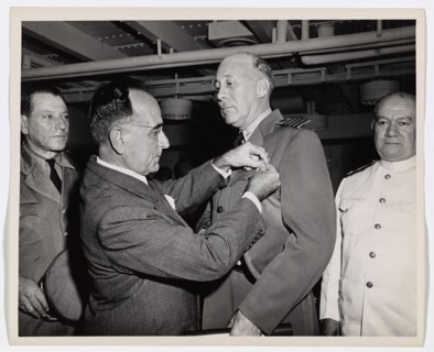 Coast Guard Skipper Decorated by Brazilian President. Coast Guard Captain George W. McKean, Skipper of a troop transport in the Atlantic, is presented with the Medal of Military Merit by President Get...