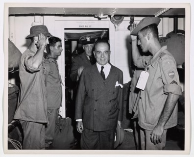 Brazilian President Inspects Coast Guard-Manned Transport. President Getulio Vargas enters the troop quarters on an inspection tour through a Coast Guard-manned troop transport which carried Brazilian...