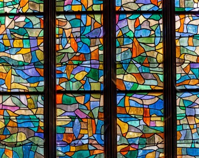 ABBEVILLE, SOMME, FRANCE, JUNE 20, 2023 :  details of stained glasses windows in Saint Sepulcre church, by Alfred Manessier workshop, year 1989  to 19