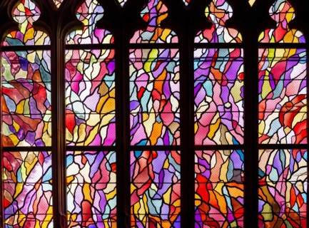 ABBEVILLE, SOMME, FRANCE, JUNE 20, 2023 :  details of stained glasses windows in Saint Sepulcre church, by Alfred Manessier workshop, year 1989  to 19