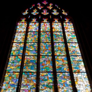 ABBEVILLE, SOMME, FRANCE, JUNE 18, 2023 :  details of stained glasses windows in Saint Sepulcre church, by Alfred Manessier workshop, year 1989  to 19