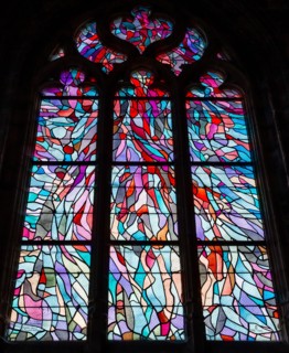 ABBEVILLE, SOMME, FRANCE, JUNE 18, 2023 :  details of stained glasses windows in Saint Sepulcre church, by Alfred Manessier workshop, year 1989  to 19