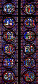 Interior of Sainte-Chapelle showing detail of medieval stained glass window panels Paris France Europe EU