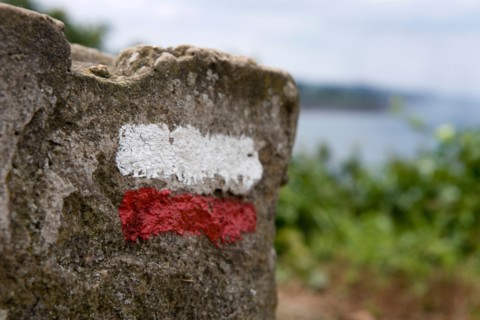 France, Brittany, Saint-Quay-Portrieux, Mark of the coastal trail Sentier des Douaniers GR34