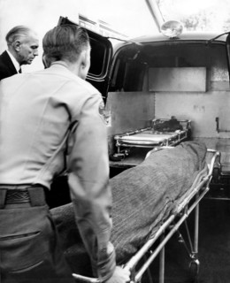 Cloaked corpse of starlet Marilyn Monroe after she was found dead
