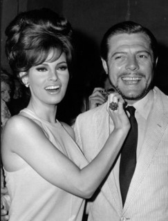 Actors Marcello Mastroianni and Raquel Welch at party