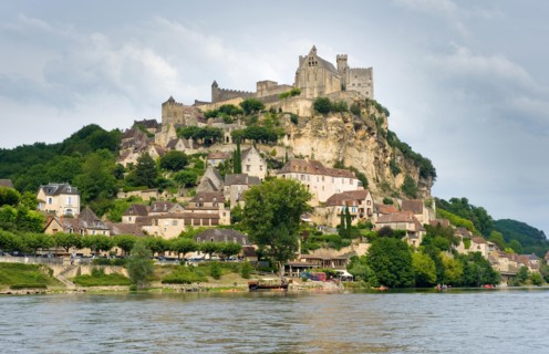 The france city of Beynac-et-Cazenac as seen from the river Dordogne