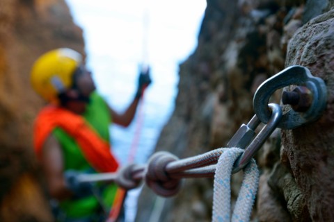 carabiner and climbing rope for canyoning in the canyon called Souffleur on the cliff of La Ciotat, France, Provence, Calanques National Park, La Ciotat