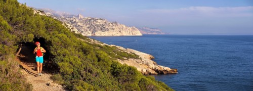 female wanderer walking on footpath along the rocky coast, France, Provence, Calanques National Park, Marseille Cassis La Ciotat