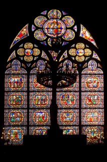 Stained glass window on southern facade of Notre Dame cathedral in Paris, France.