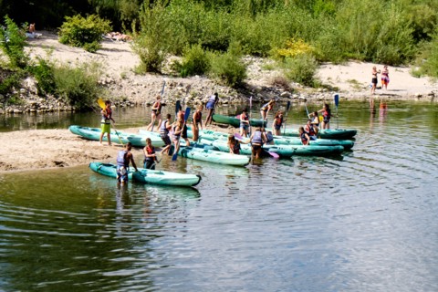 Canoeists preparing by the side of the Ardeche river, France