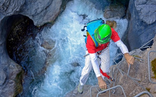 climber at Via ferrata of Chateau Queyras, France, Hautes Alpes