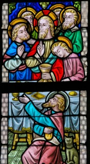 LIER, BELGIUM - MAY 16, 2015: Stained Glass window in St Gummarus Church in Lier, Belgium, depicting Jesus and the Apostles at t
