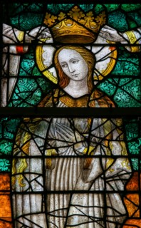 LIER, BELGIUM - MAY 16, 2015: Stained Glass window (1450) in St Gummarus Church in Lier, Belgium, depicting the Coronation of Ma