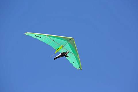 Hang glider flying over Dune of Pyla Southern France