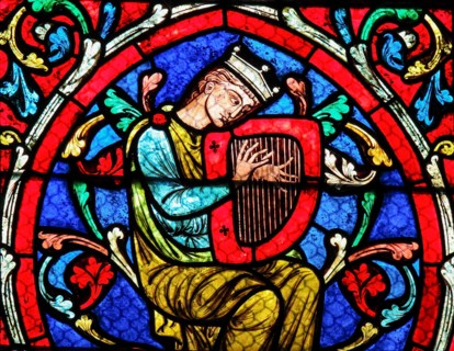 Stained glass window in the Notre Dame Cathedral in Paris, depicting King David playing on his Harp.